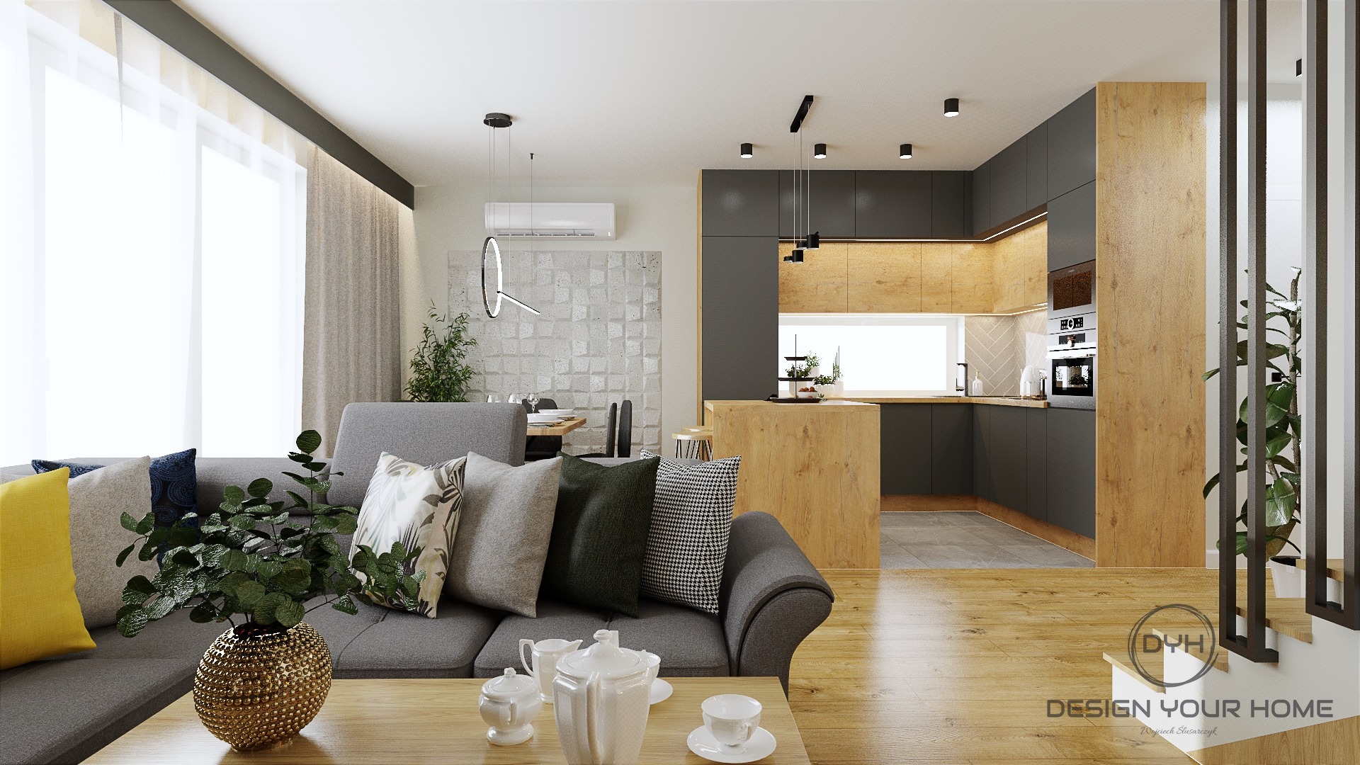 Nowoczesne wnętrze mieszkania z otwartą kuchnią, szarą sofą z dekoracyjnymi poduszkami i drewnianą podłogą, oświetlone światłem dziennym.