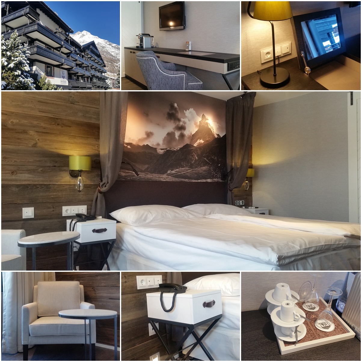 Wnętrze pokoju hotelowego z drewnianymi panelami ściennymi, łóżkiem z górskim motywem na ścianie, stolikiem nocnym na metalowym stelażu i widokiem na ośnieżony szczyt górski za oknem.