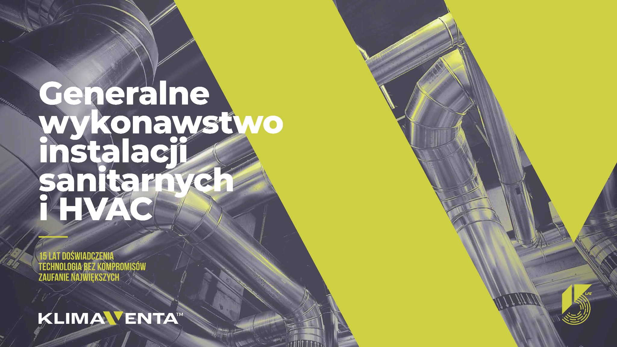 Metalowe rury wentylacyjne pod sufitem, układające się w skomplikowaną sieć. Na pierwszym planie żółty pas z tekstem reklamowym.