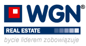 Logo WGN Real Estate z czerwonym kwadratem w lewym górnym rogu i napisem 'bycie liderem zobowiązuje' poniżej, na białym tle.
