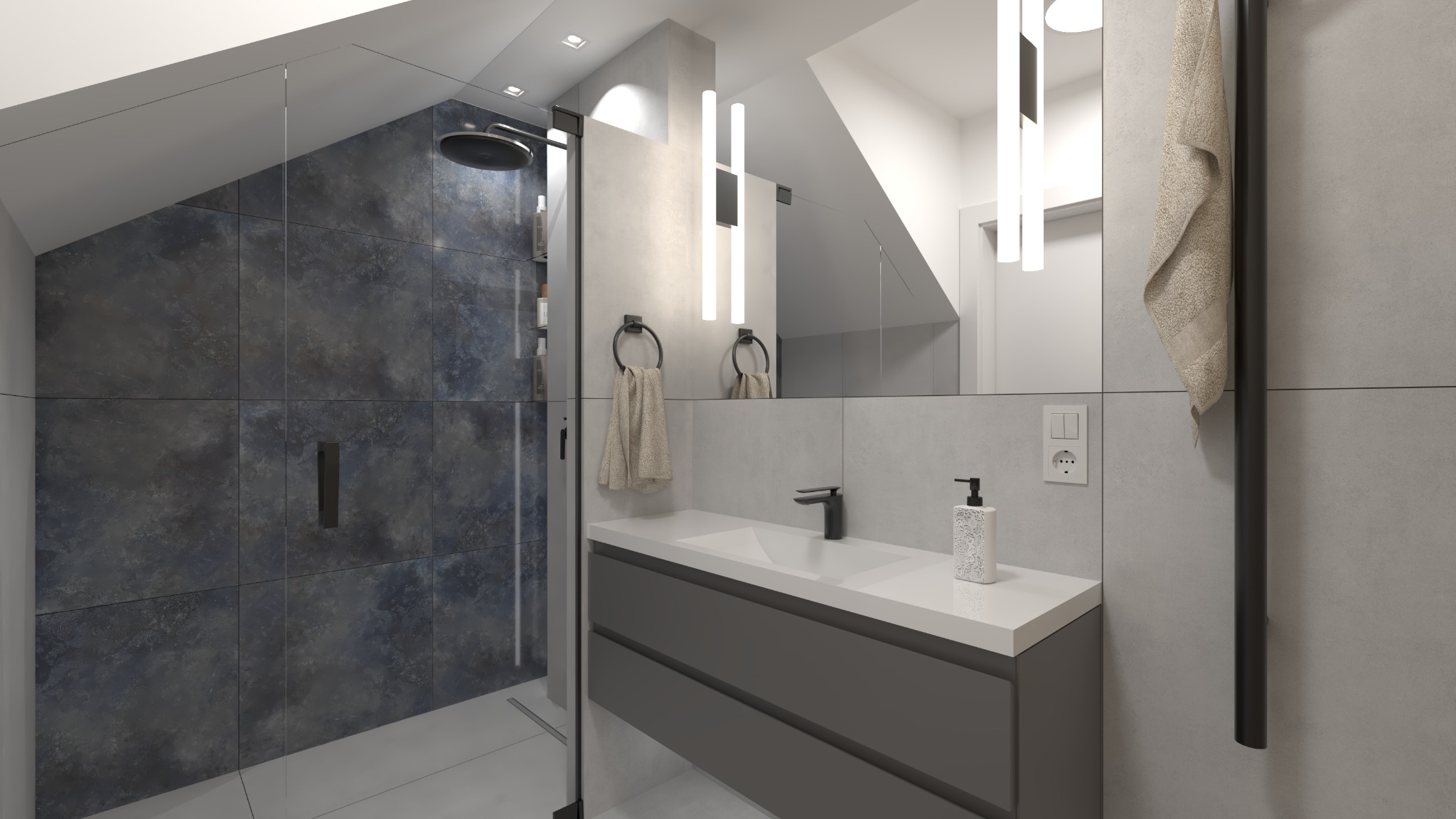 Nowoczesna łazienka na poddaszu z kabiną prysznicową wyłożoną ciemnymi płytkami imitującymi kamień, białą umywalką z szarą szafką, podświetlanym lustrem i czarną armaturą.