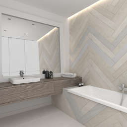 Projektant Katarzyna Lewicka - Nowoczesna łazienka z drewnianą ścianą ułożoną w jodełkę, podświetlane lustro nad blatem z umywalką, minimalistyczna wanna.