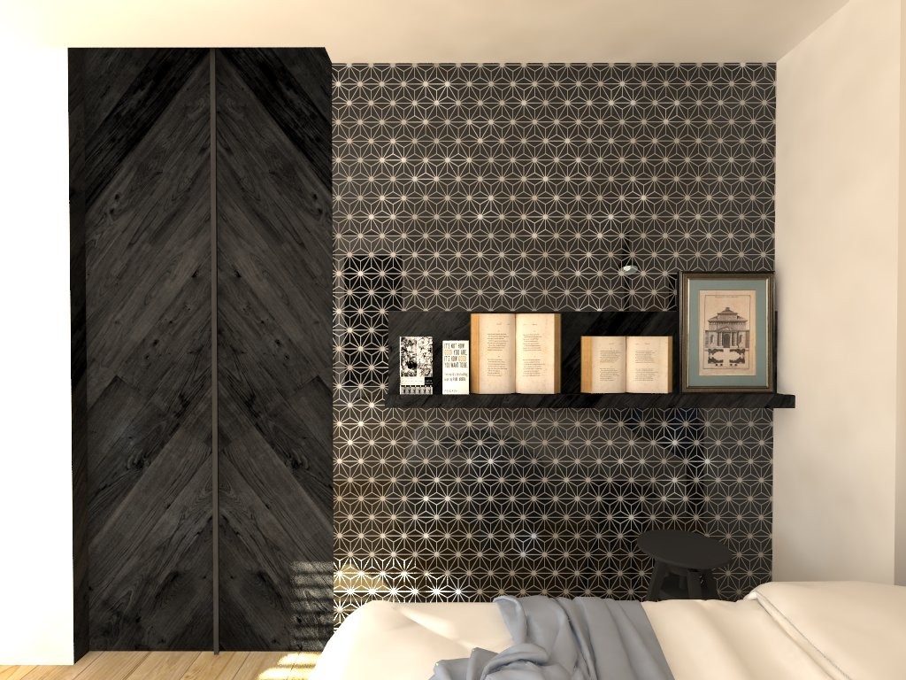 Sypialnia z ciemną, drewnianą szafą z wzorem chevron, półka z książkami i grafiką na tle ściany w geometryczny wzór.