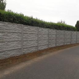 Ogrodzenia betonowe Wyburzenia roboty ziemne produkcja ogrodzeń betonowych - Ogrodzenia betonowe Żmigród