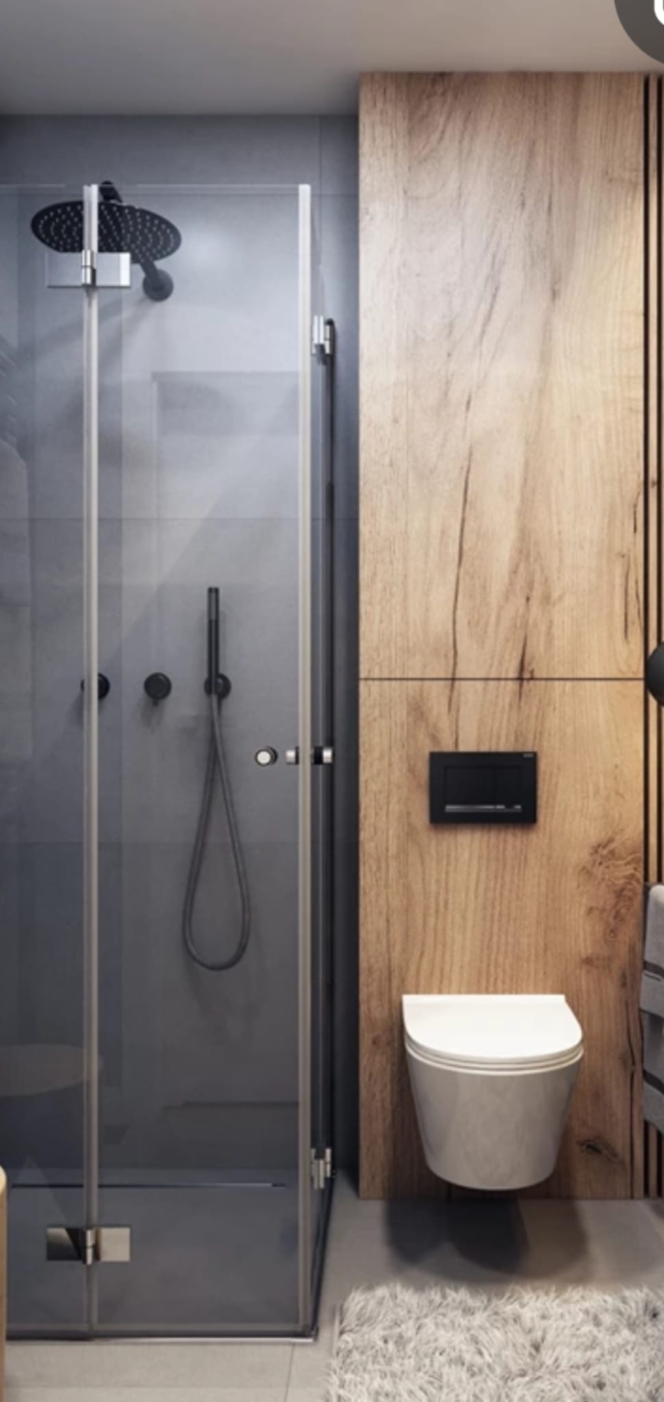 Nowoczesna łazienka z kabiną prysznicową typu walk-in, szarą glazurą, drewnianą okładziną ścienną za toaletą podwieszaną i czarną armaturą.