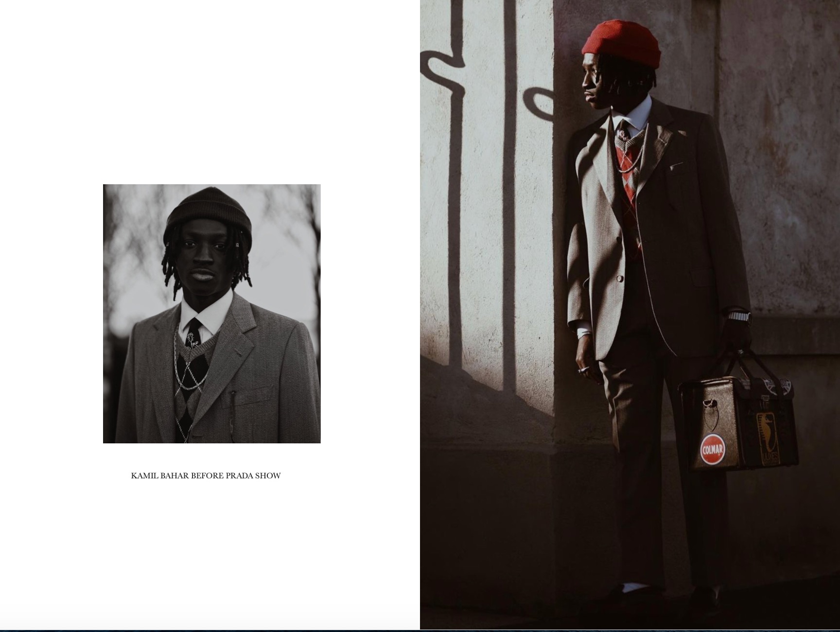 Mężczyzna w garniturze i czerwonej czapce pozuje pod ścianą z cieniem, trzymając skórzaną torbę z naszywkami.