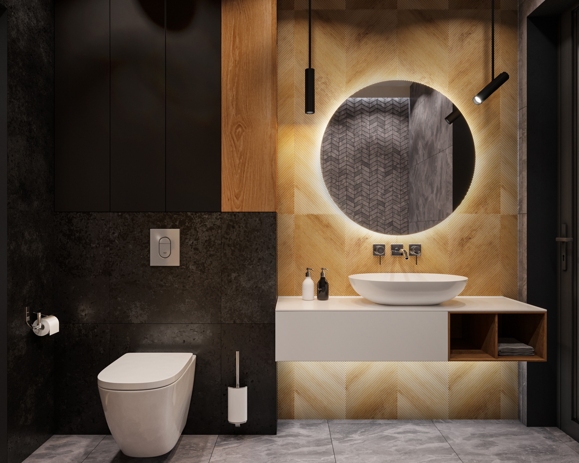 Nowoczesna łazienka z podświetlanym okrągłym lustrem, wiszącą białą umywalką, czarnymi szafkami i drewnianymi akcentami, wykończona płytkami w odcieniach szarości i złota.