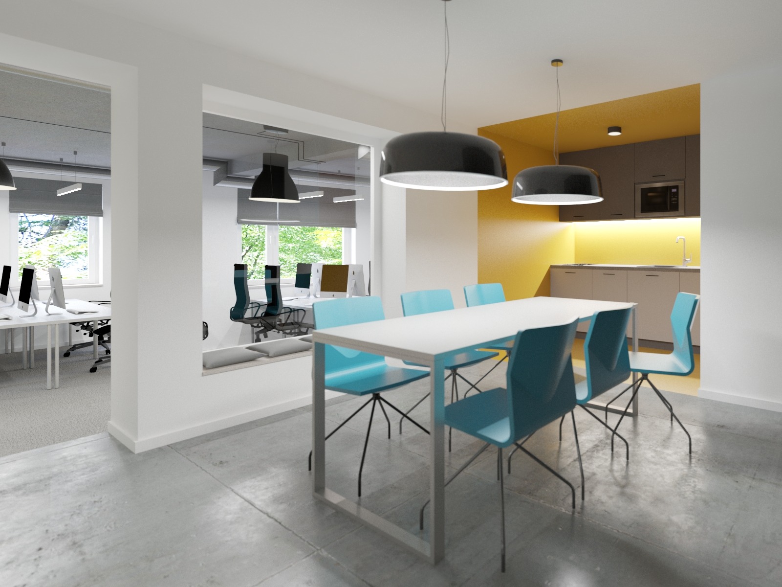 Wnętrze biura z aneksem kuchennym, biały stół z turkusowymi krzesłami pod czarnymi lampami wiszącymi, widok na stanowiska pracy z komputerami.