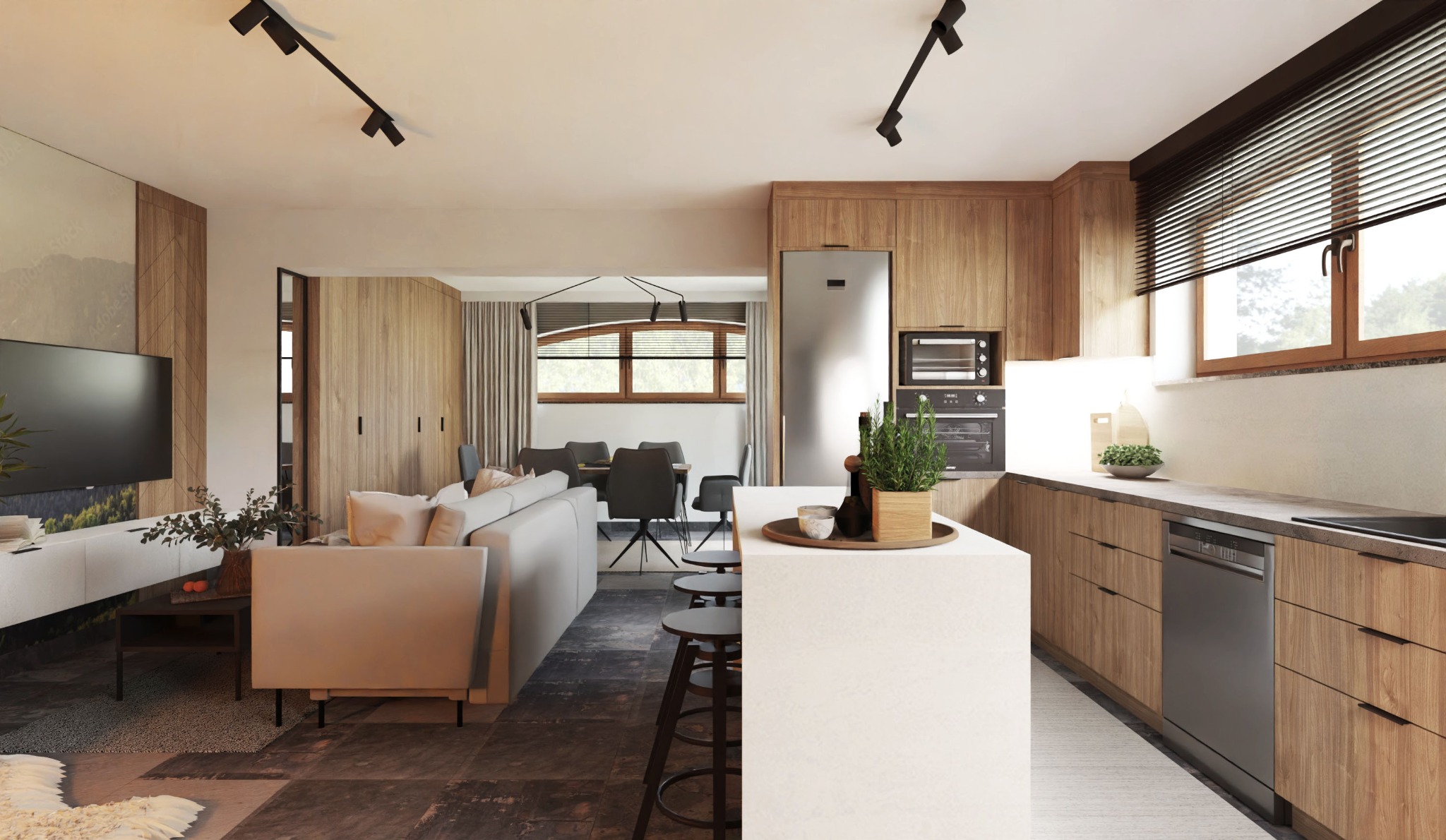 Wnętrze otwartej przestrzeni: salon z szarą sofą i telewizorem na tle ściany z motywem górskim łączy się z jadalnią z szarymi krzesłami i kuchnią z drewnianymi szafkami, białym blatem i stalową...