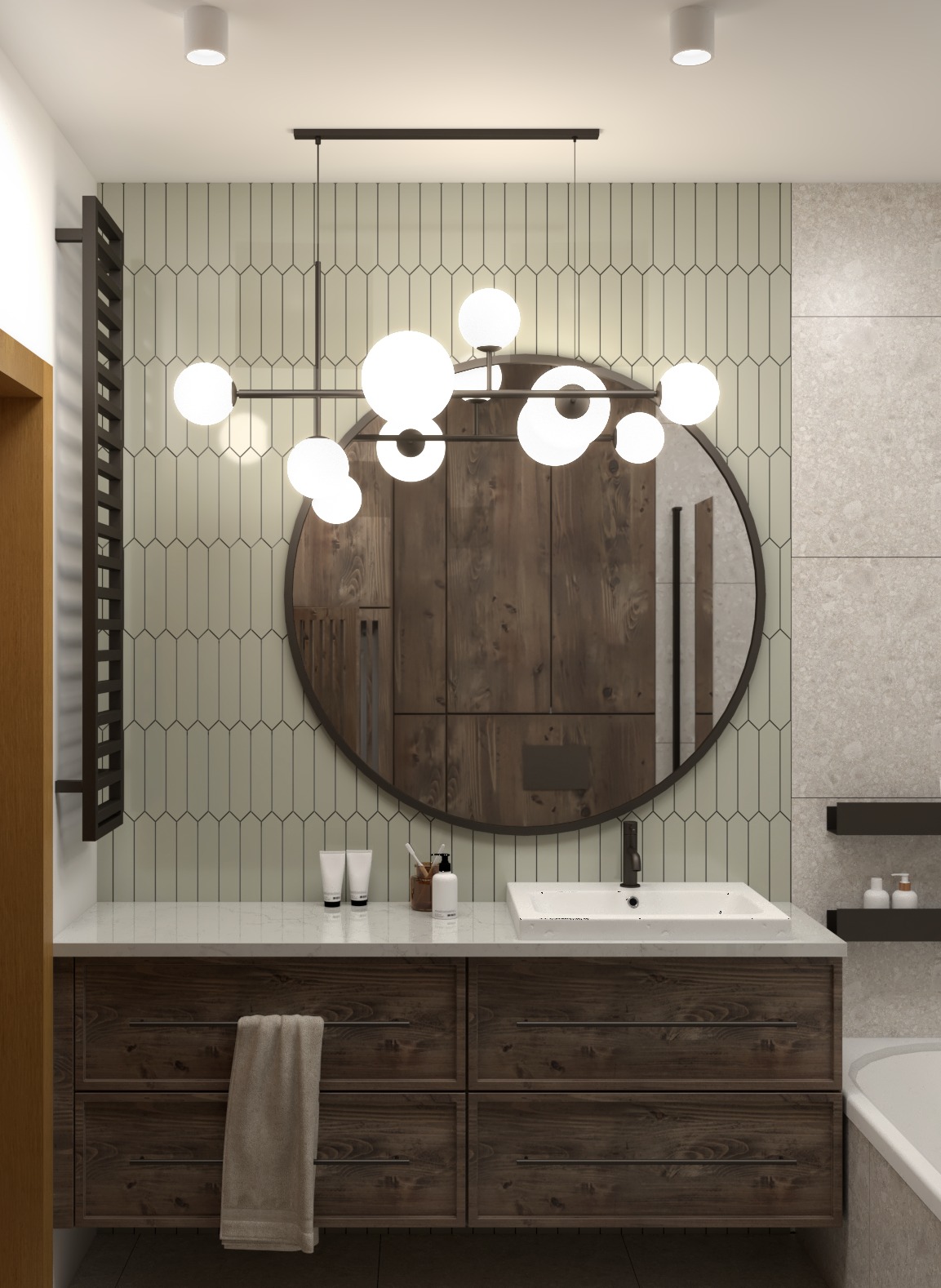 Nowoczesna łazienka z drewnianą szafką pod umywalką, okrągłym lustrem i designerską lampą z kulistymi kloszami, na ścianie pionowe płytki w odcieniach beżu.