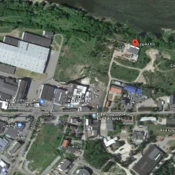 Zdjęcie satelitarne Włocławka z widocznymi budynkami przemysłowymi, fabrykami i drogami, z zaznaczoną lokalizacją firmy przy ulicy Łęgskiej.