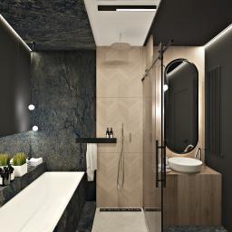 Żeromska Projektowanie wnętrz - Elegancka łazienka w ciemnej tonacji z elementami drewna, z wanną obłożoną kamieniem, prysznicem typu walk-in z deszczownicą oraz umywalką nablatową z okrągłym lustrem z podświetleniem LED.