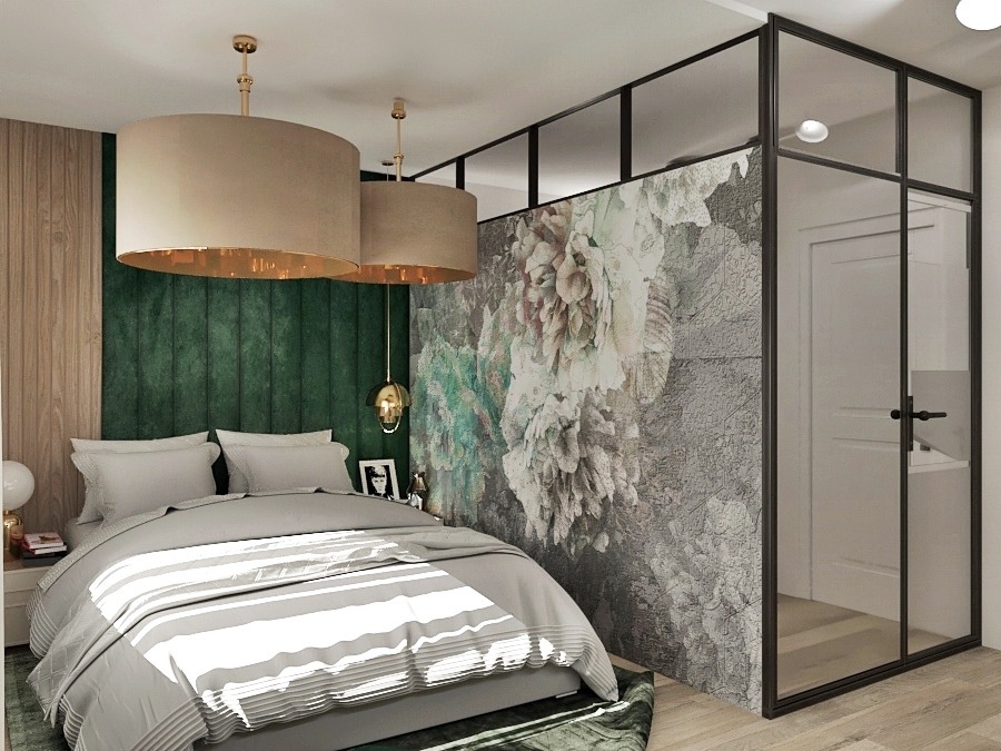 Sypialnia z łóżkiem w szarościach, zielonym panelem ściennym i dwiema okrągłymi lampami wiszącymi, oddzielona szklaną ścianą z czarną ramą i motywem kwiatowym.