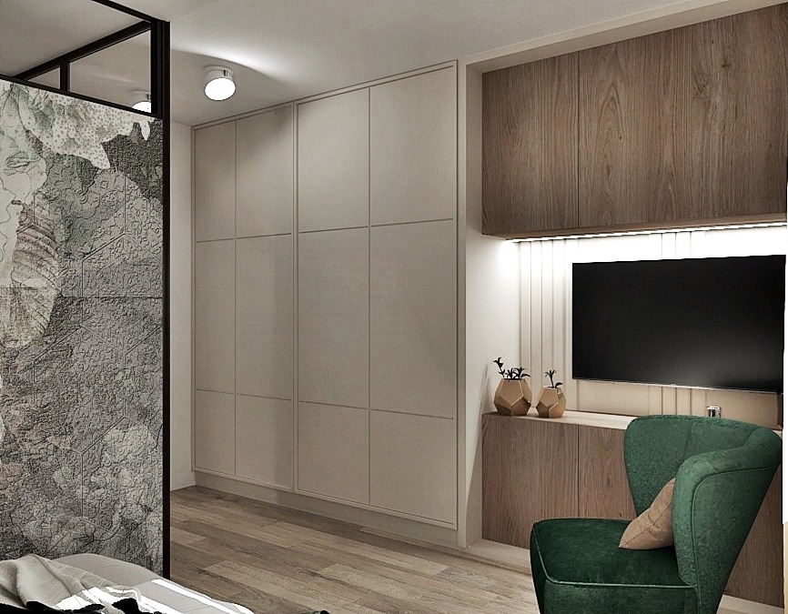 Minimalistyczna sypialnia z dużą szafą w zabudowie, drewnianymi szafkami RTV podświetlonymi LED, zielonym fotelem i dekoracyjną ścianką działową z motywem roślinnym.