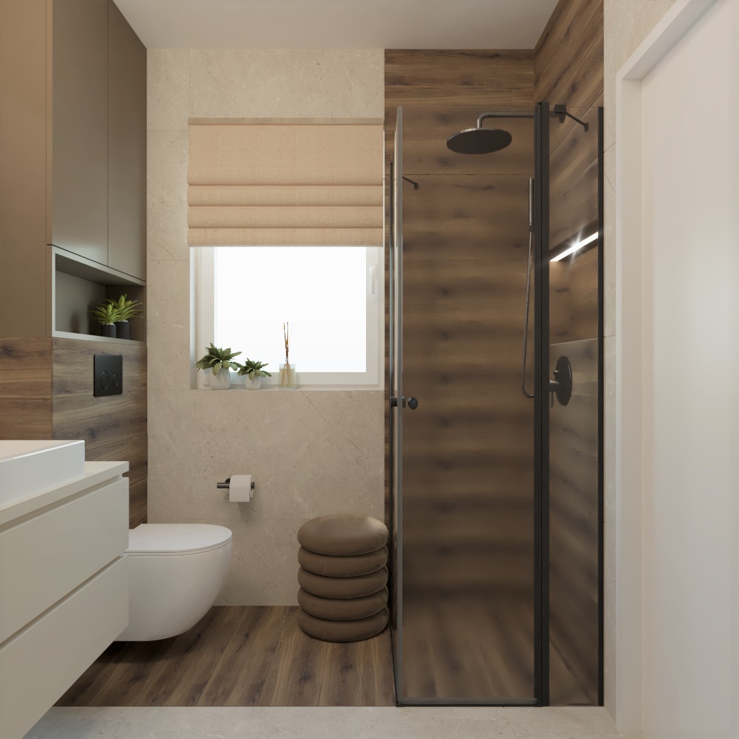 Nowoczesna łazienka z kabiną prysznicową typu walk-in, drewnopodobnymi płytkami na ścianie i podłodze, wiszącą toaletą i umywalką, oraz okrągłym pufem z brązowej skóry ekologicznej.