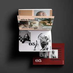 Władysław Gawlas - Otwarty katalog z fotografiami portretowymi i modowymi, ułożony na ciemnoszarym tle, prezentujący portfolio fotografa.