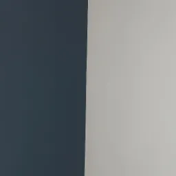 Ściana pomalowana na dwa kolory: ciemny granat i jasny szary, z delikatnym cieniem na styku kolor&oacute;w.
