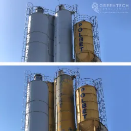 Silosy na materiały budowlane, jeden odświeżony szarym kolorem, drugi z widocznymi śladami użytkowania i napisem POLBET na tle błękitnego nieba.