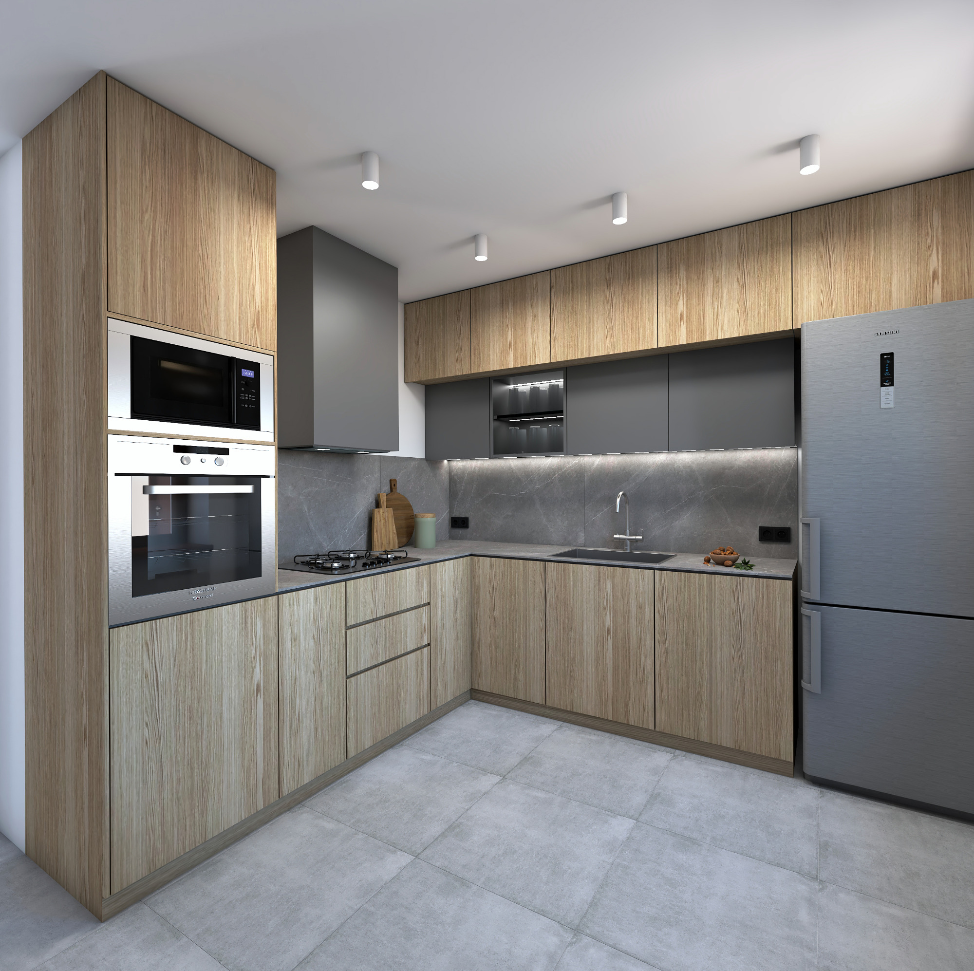 Wnętrze kuchni z drewnianymi szafkami, szarym blatem i marmurową ścianą, oświetlone punktowymi lampami sufitowymi, z widocznym piekarnikiem, mikrofalówką i lodówką Samsung.