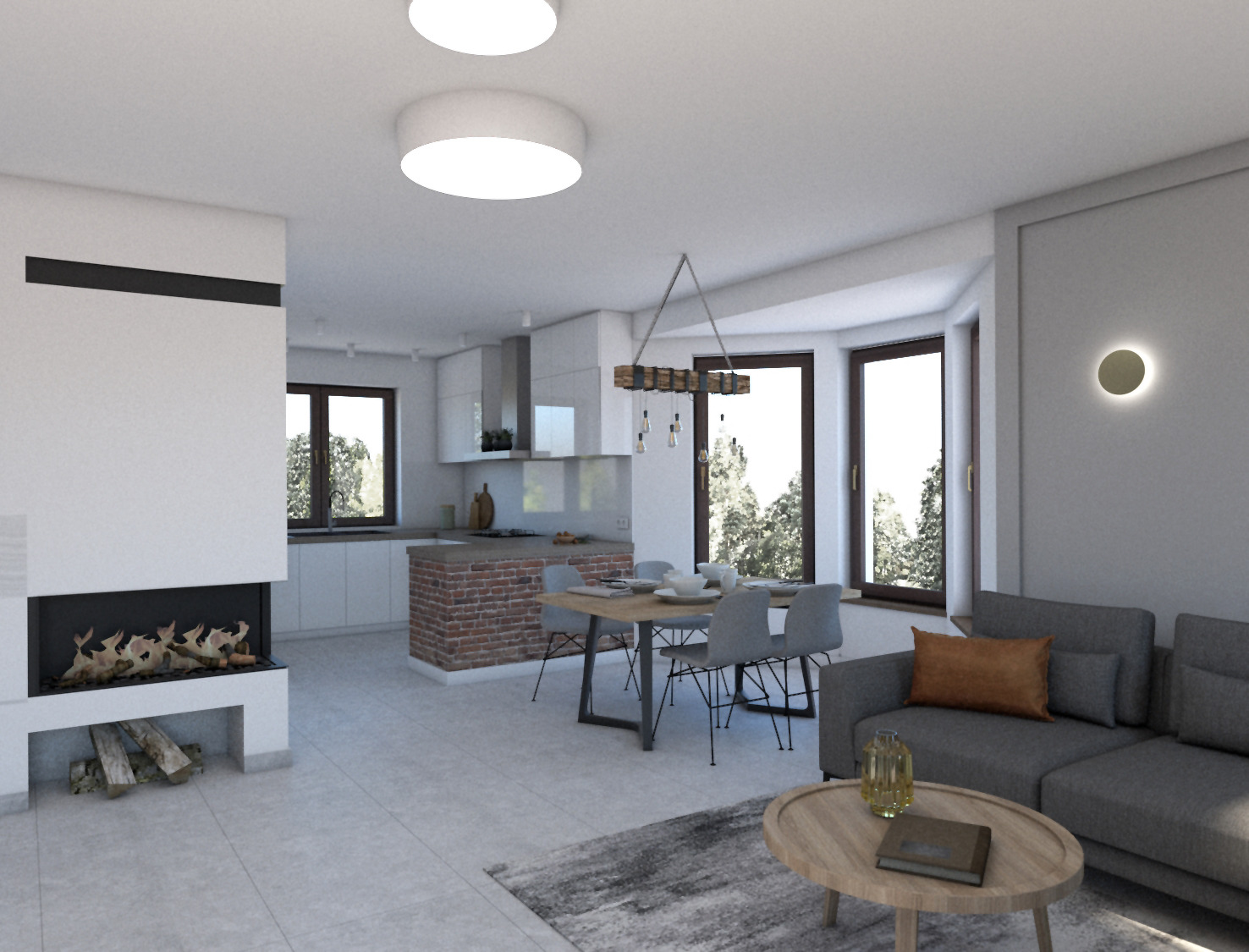 Wnętrze nowoczesnego salonu z kominkiem, ceglaną wyspą kuchenną i szarym narożnikiem, oświetlone dwoma okrągłymi lampami sufitowymi.