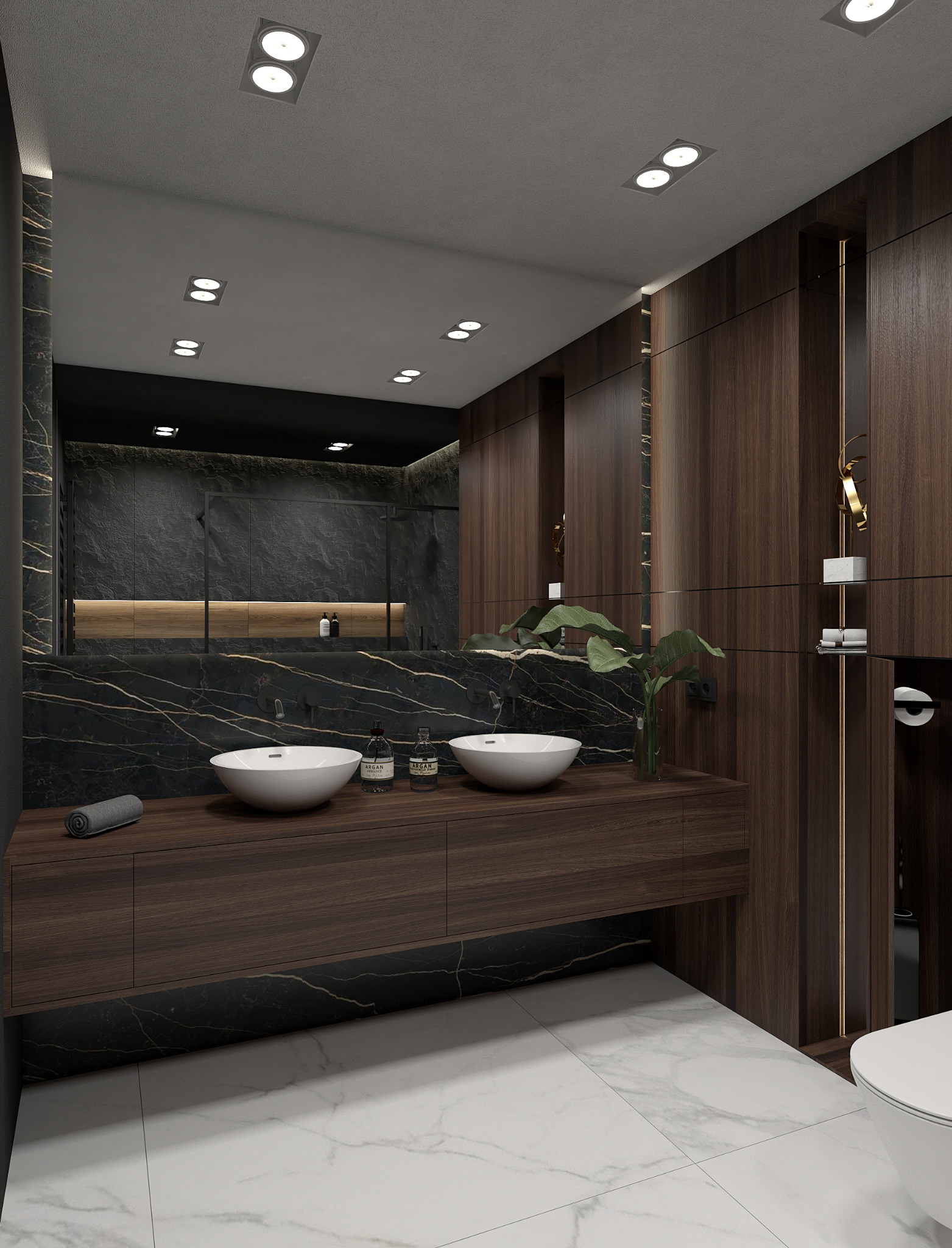 Nowoczesna łazienka z dwoma białymi umywalkami na drewnianym blacie, czarnym marmurowym wykończeniem ścian i podświetlanym lustrem, uzupełniona o roślinę w szklanym wazonie i białą marmurową podłogę.