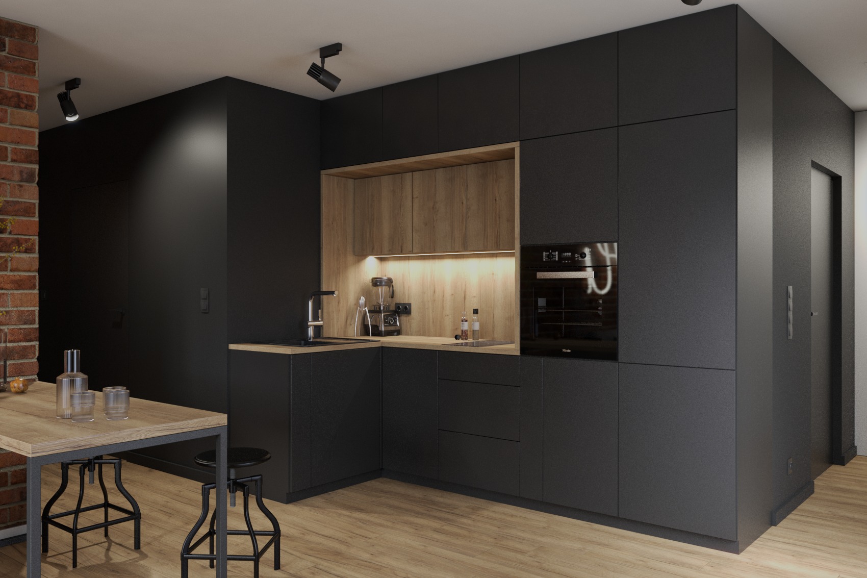 Nowoczesna kuchnia z czarnymi matowymi frontami, drewnianymi akcentami i ceglaną ścianą w tle. Widoczny stół z metalowymi nogami i drewnianym blatem oraz hoker.