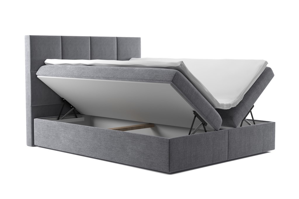 Szare łóżko tapicerowane z podnoszonym stelażem i pojemnikiem na pościel, widoczne mechanizmy podnoszące, biała pościel na materacu.
