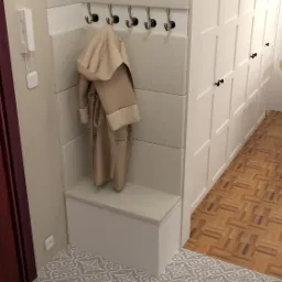 Wizualizacja przedpokoju z wbudowaną szafą, siedziskiem i wieszakami, na których wisi beżowy płaszcz. Na podłodze wzorzyste płytki i parkiet. W głębi widoczny fragment jadalni z wiklinowymi krzesłami.