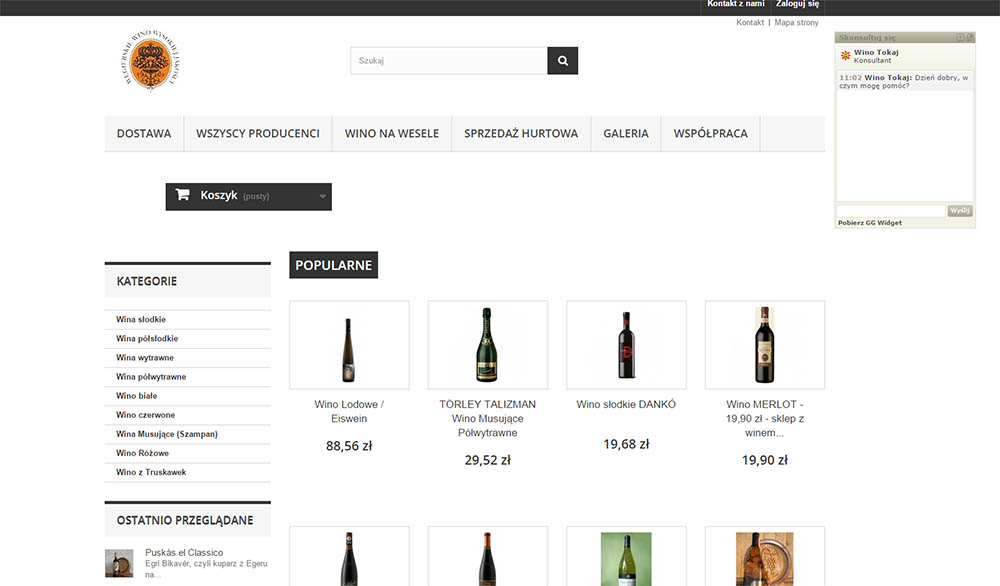 Widok strony internetowej sklepu z winami, prezentujący kategorie, popularne produkty i funkcję koszyka.