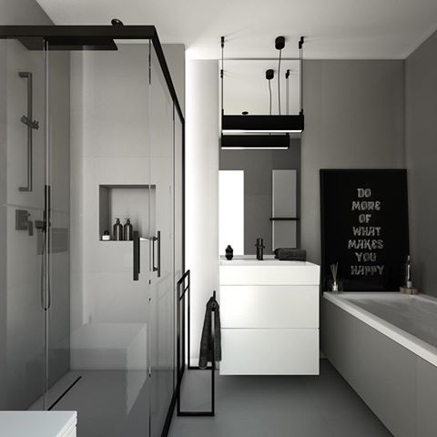 Nowoczesna łazienka w odcieniach szarości i bieli z czarnymi akcentami, kabina prysznicowa typu walk-in z deszczownicą, minimalistyczna umywalka z szafką, wiszące lampy i plakat z motywacyjnym...
