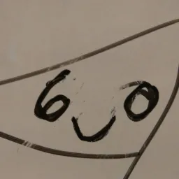 Czarny marker na białej tablicy narysował uproszczony uśmiech z cyfry 6 i litery O, otoczony niedokładną ramką.