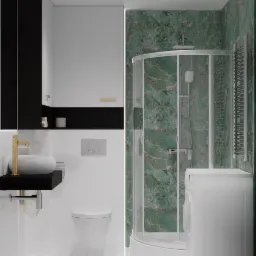 Nowoczesna łazienka z zielonym marmurem na ścianach kabiny prysznicowej, białą armaturą, czarnymi akcentami w szafkach i złotą baterią umywalkową.