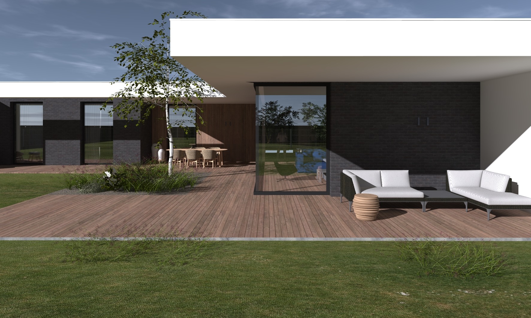 Nowoczesny dom jednorodzinny w Ostrowie Wlkp. z drewnianym tarasem, czarną elewacją z cegły klinkierowej i białym zadaszeniem, z minimalistycznym zestawem mebli ogrodowych.