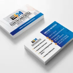 Stos wizytówek firmy Elektromlostek z Jaworzna, prezentujących logo, dane kontaktowe i zakres usług, w tym systemy alarmowe i pomiary elektryczne.