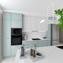 GTO GROUP Andrzej Liczbiński - Nowoczesna kuchnia z akcentami pastelowej zieleni: zabudowa kuchenna, wyspa z marmurowym blatem i minimalistycznym oświetleniem. Jasne, przestronne wnętrze z roślinami.