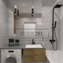 Wizualizacja nowoczesnej łazienki z pralką Miele pod blatem umywalki, drewnianymi szafkami, czarną armaturą i minimalistycznymi lampami wiszącymi.