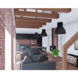 Wizualizacja wnętrza domu z ceglaną ścianą, drewnianymi belkami stropowymi, czarnymi lampami wiszącymi i kominkiem, sofa w odcieniach szarości, widok na kuchnię w tle.