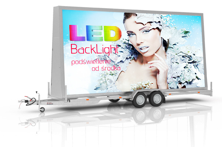 Mobilna przyczepa reklamowa z podświetlanym panelem LED prezentująca wizerunek kobiety w zimowej stylizacji i napis Backlight.