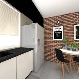 Denis Projektuje - Wizualizacja nowoczesnej kuchni z ceglaną ścianą, białymi szafkami z czarnym blatem, okrągłym stołem z czarnymi krzesłami i plakatami na ścianie.