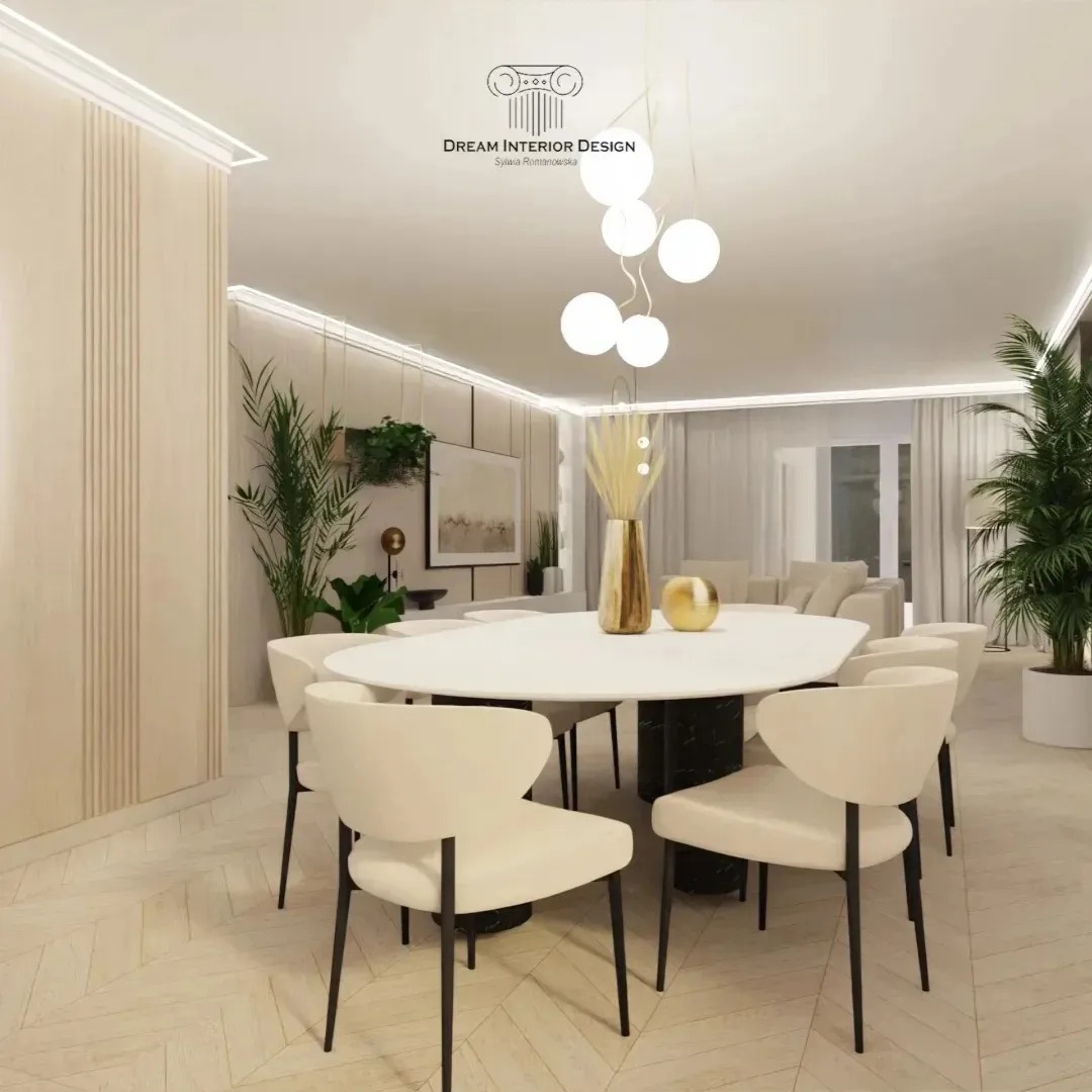 Jasne wnętrze jadalni z owalnym stołem na marmurowej podstawie, otoczonym krzesłami z beżową tapicerką i czarnymi nogami. Nad stołem wisi nowoczesna lampa z kulistymi kloszami. W tle widoczne...