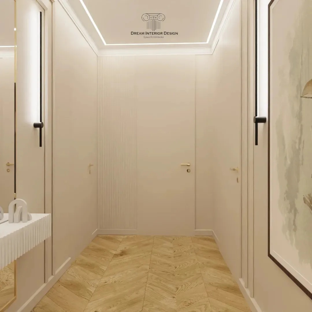 Korytarz w jasnych barwach z parkietem ułożonym we wzór jodełki francuskiej, oświetleniem LED na suficie i minimalistyczną konsolą przy lustrze.