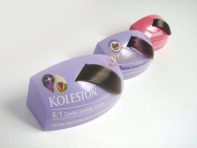 Próbki farb do włosów w opakowaniach Koleston, Relledy i Cameleo prezentujące odcienie brązu, ułożone ukośnie na białym tle.