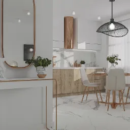 Nowoczesna jadalnia z okrągłym stołem, krzesłami na złotych nogach i marmurową podłogą, widok na kuchnię z drewnianymi szafkami i złotym okapem.