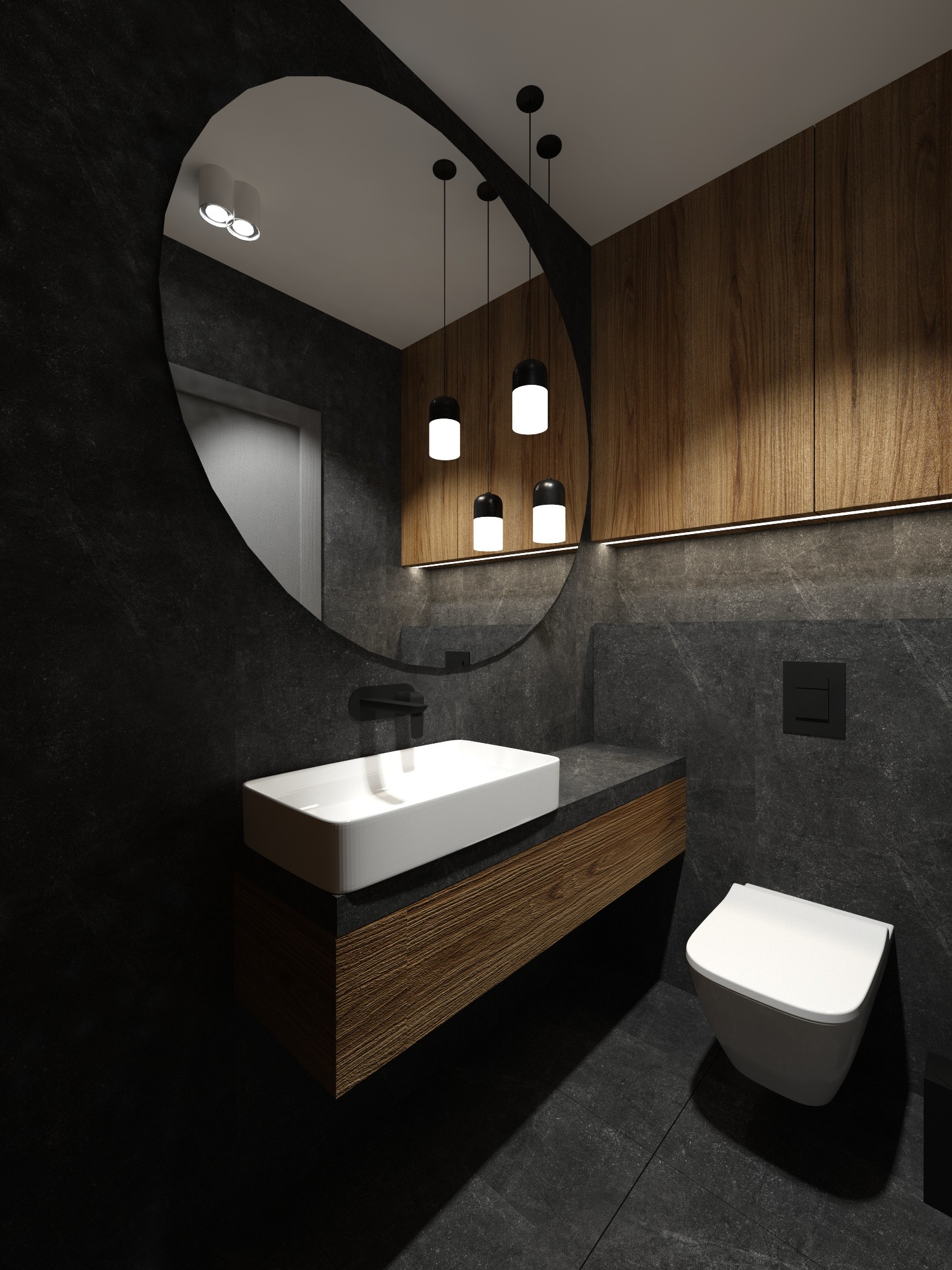 Nowoczesna łazienka z czarnymi ścianami z efektem kamienia, drewnianą szafką pod umywalką, owalnym lustrem z czarną ramą, wiszącą toaletą i trzema wiszącymi lampami z białymi kloszami.