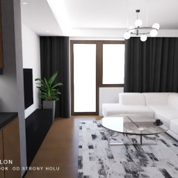 Joanna Wróbel Architektura - Wnętrze salonu z białym narożnikiem, szklanym stolikiem i drewnianą ścianą. Widok z holu, z elementami zabudowy kuchennej i dekoracyjnymi butelkami wina.