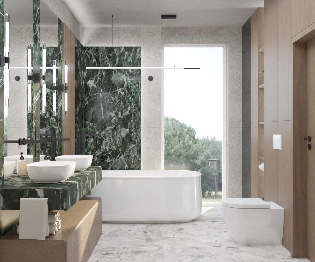 Nowoczesna łazienka z umywalkami nablatowymi na zielonym marmurowym blacie, wolnostojąca wanna przy oknie z widokiem na zieleń, minimalistyczne oświetlenie liniowe i płytki imitujące marmur...
