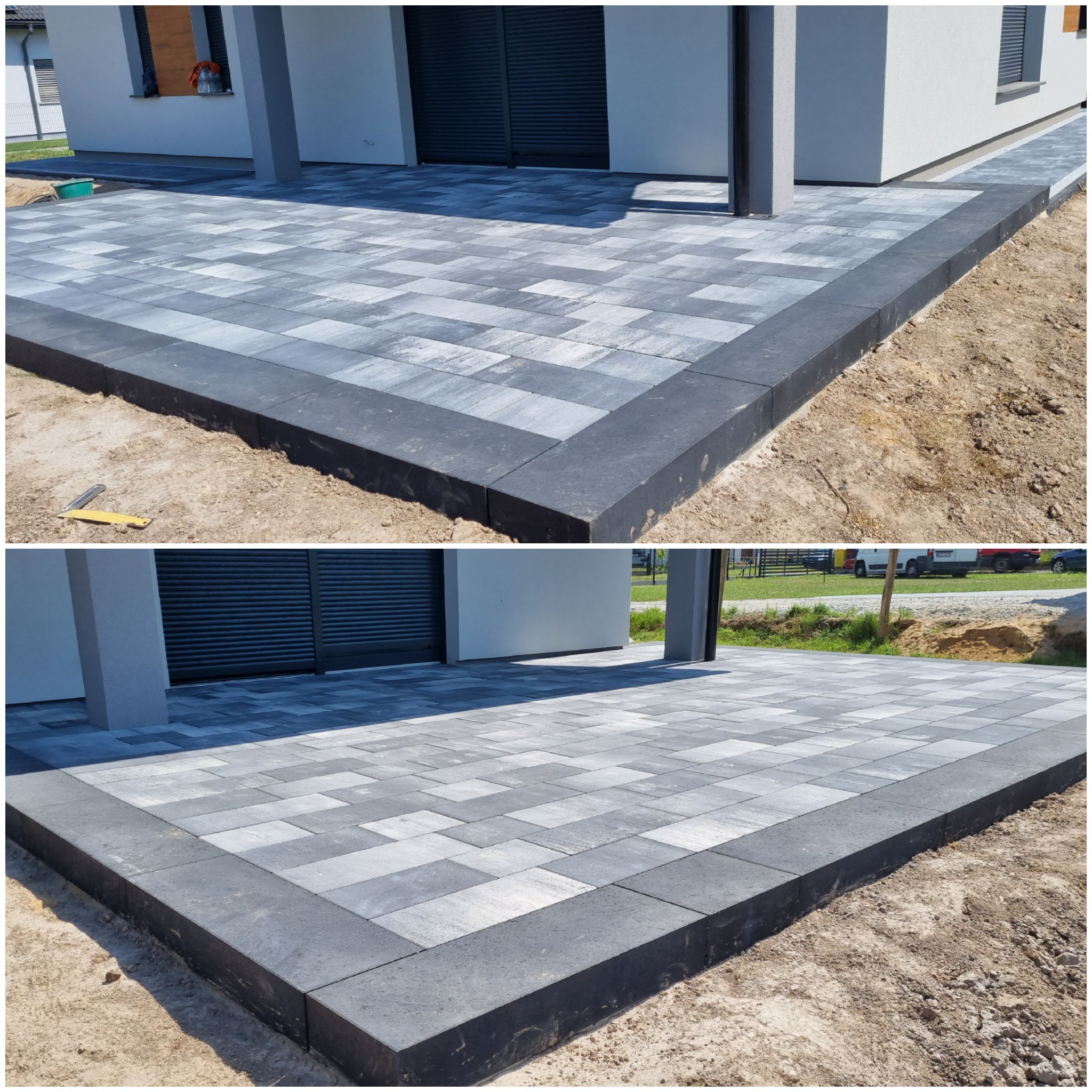 Ułożona kostka brukowa w odcieniach szarości z ciemnoszarym obrzeżem przed nowoczesnym domem z białymi ścianami i szarą stolarką okienną, widoczny fragment niezabudowanego terenu.