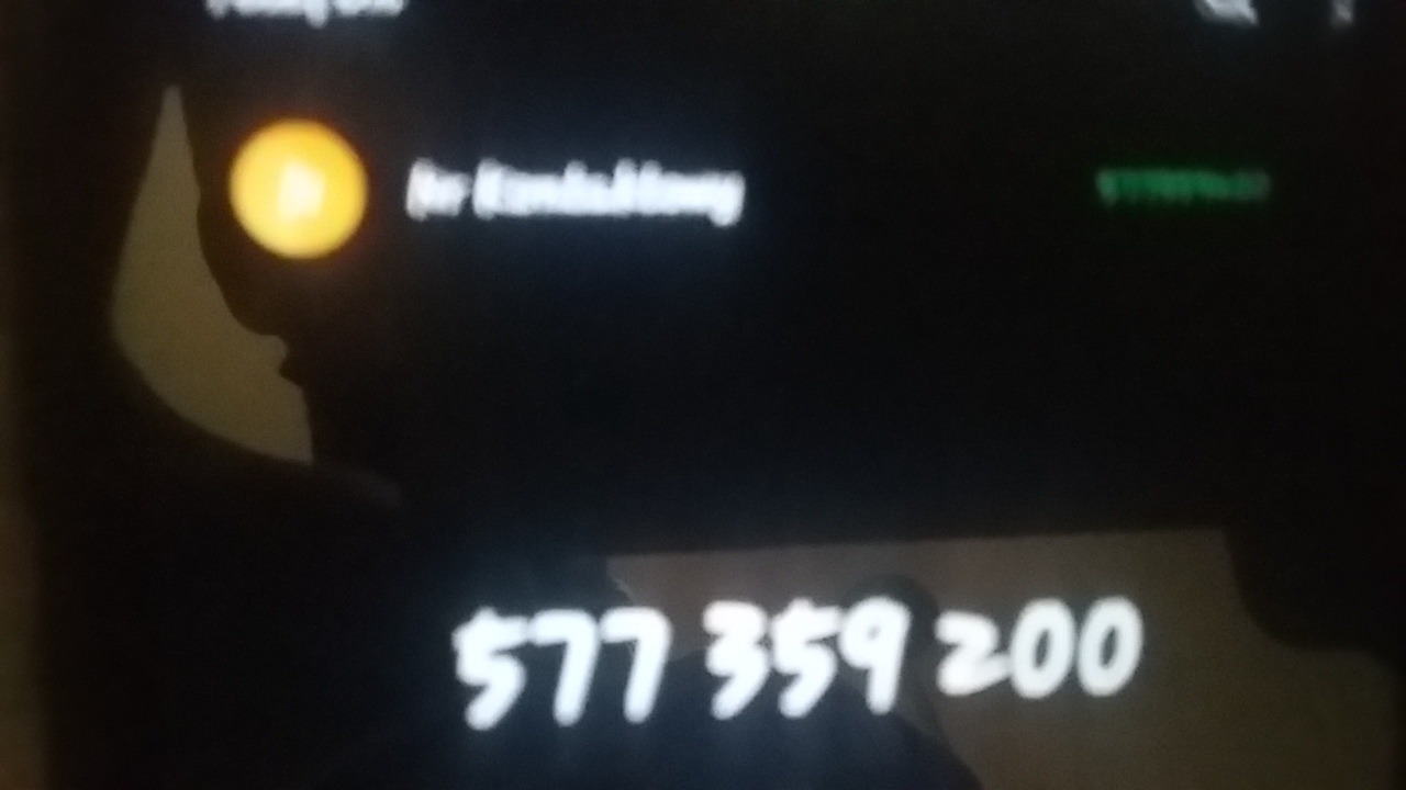 Zdjęcie ekranu telefonu wyświetlającego numer kontaktowy 577359200, z widocznym fragmentem interfejsu aplikacji.