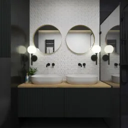 Nowoczesna łazienka z dwoma umywalkami nablatowymi, okrągłymi lustrami z podświetleniem, białą mozaiką heksagonalną na ścianie i czarną armaturą.