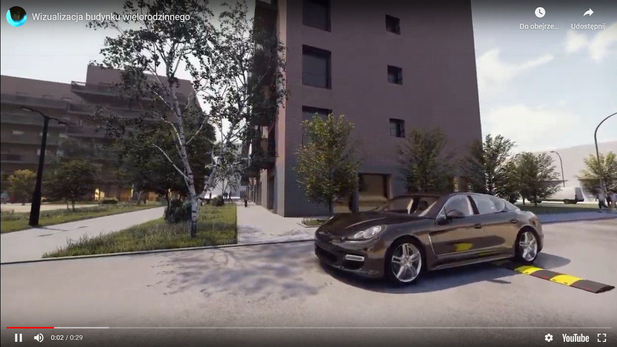 Wizualizacja architektoniczna budynku wielorodzinnego z ciemną elewacją, otoczonego zielenią i zaparkowanym brązowym samochodem sportowym przed progiem zwalniającym.